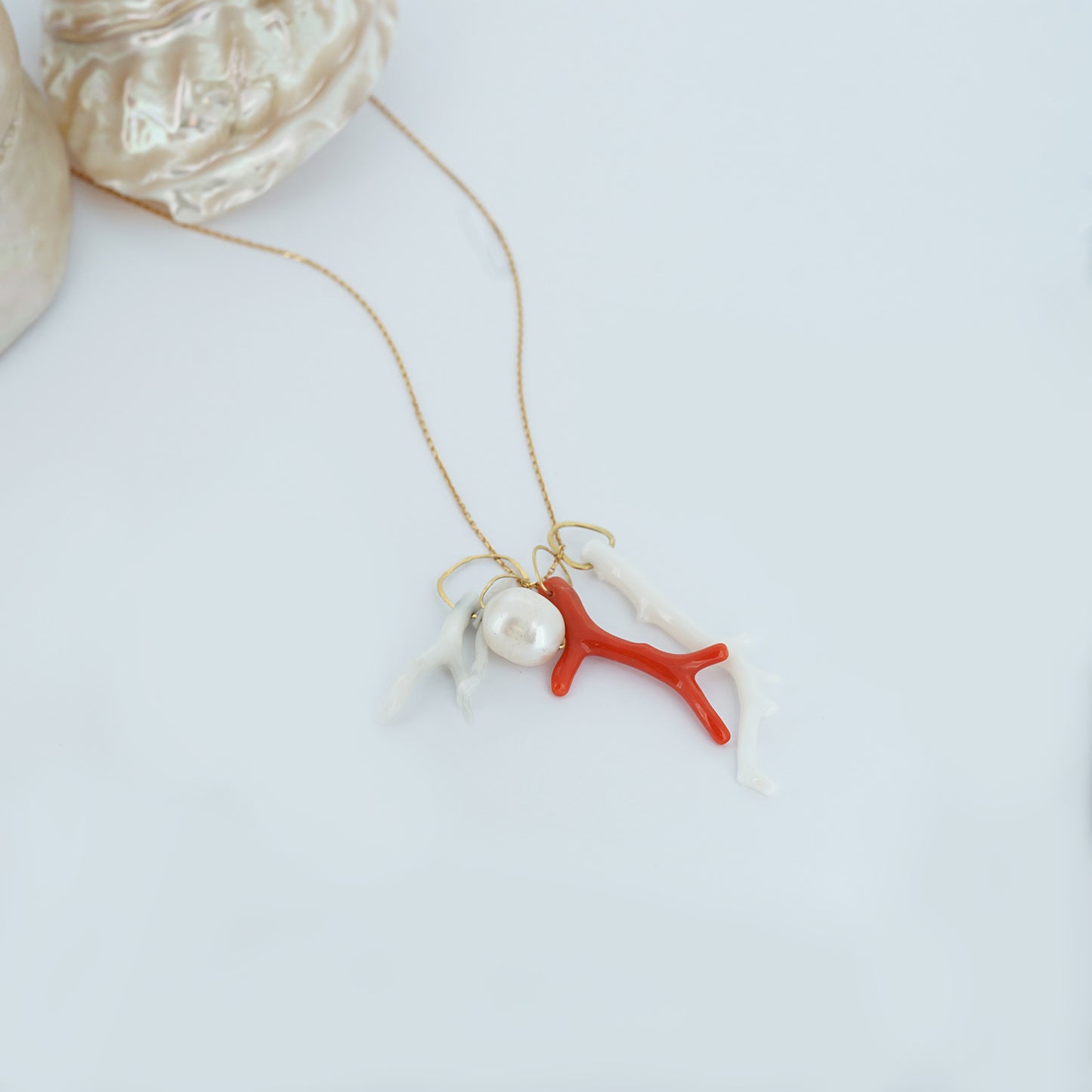 Sweet Pea 18ct gold necklace with pearl and coral branch charms