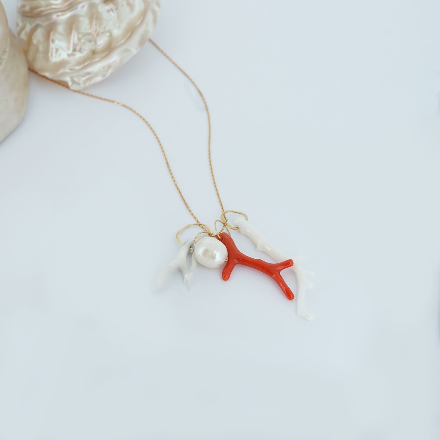 Sweet Pea 18ct gold necklace with pearl and coral branch charms