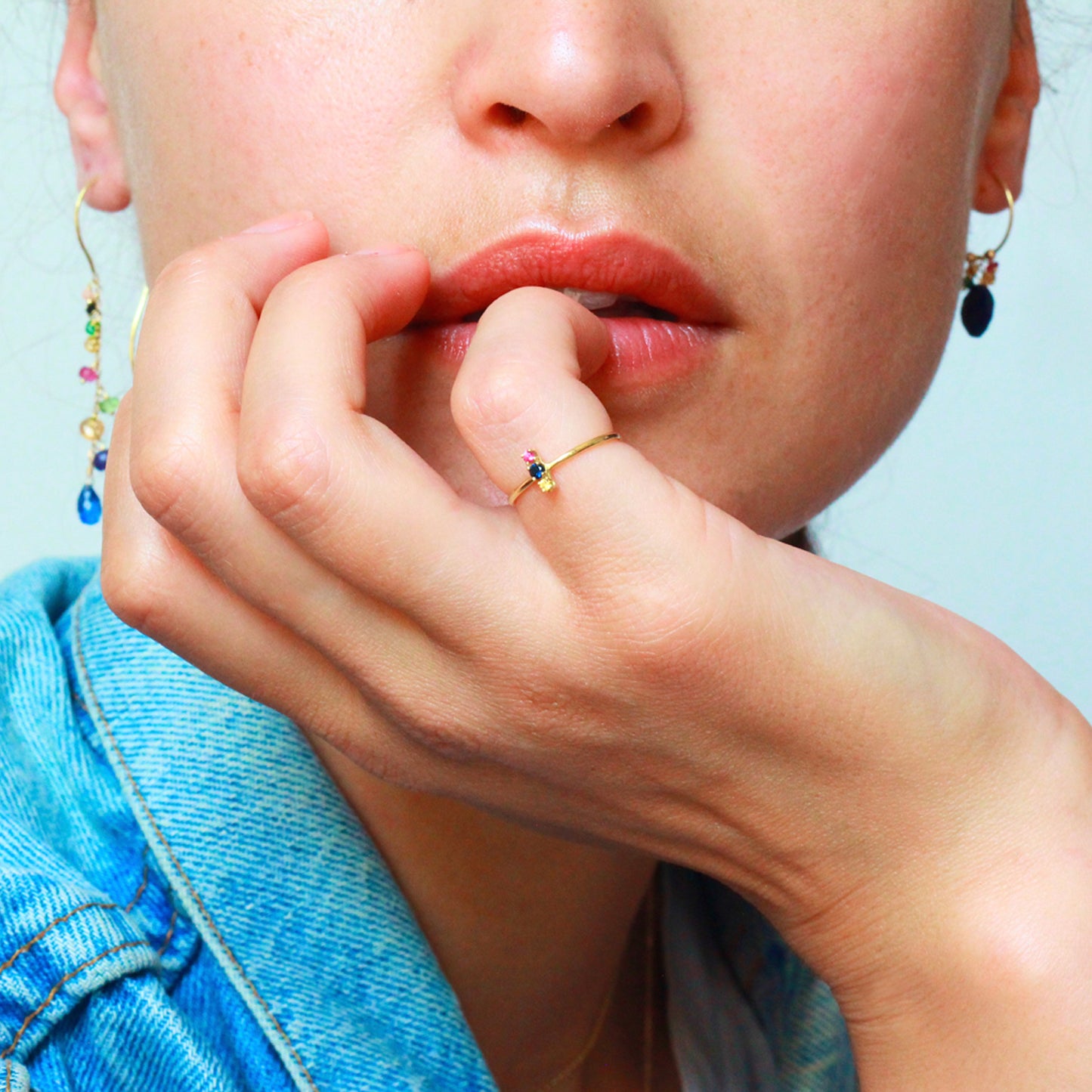 18ct yellow gold ring with yellow blue and pink set Sapphires on model