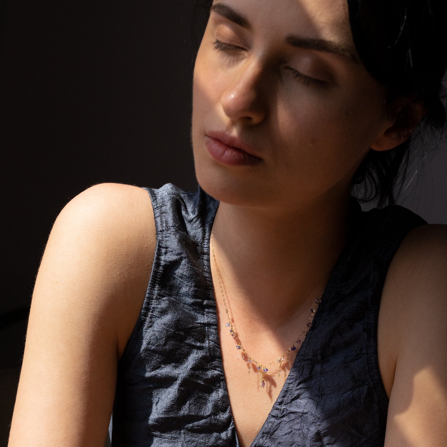 18ct yellow gold chain necklace with hanging beads and chains on model
