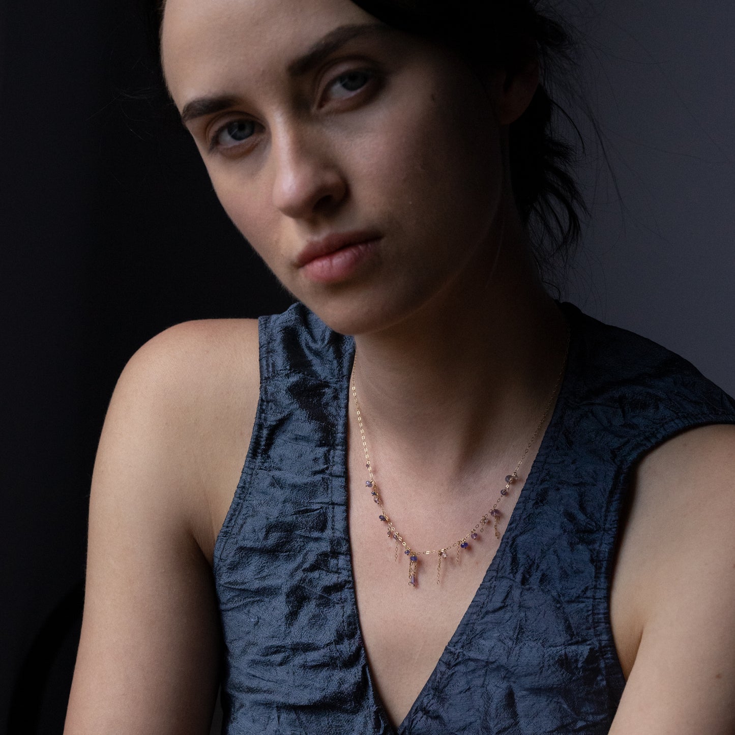 18ct yellow gold chain necklace with hanging beads and chains on model