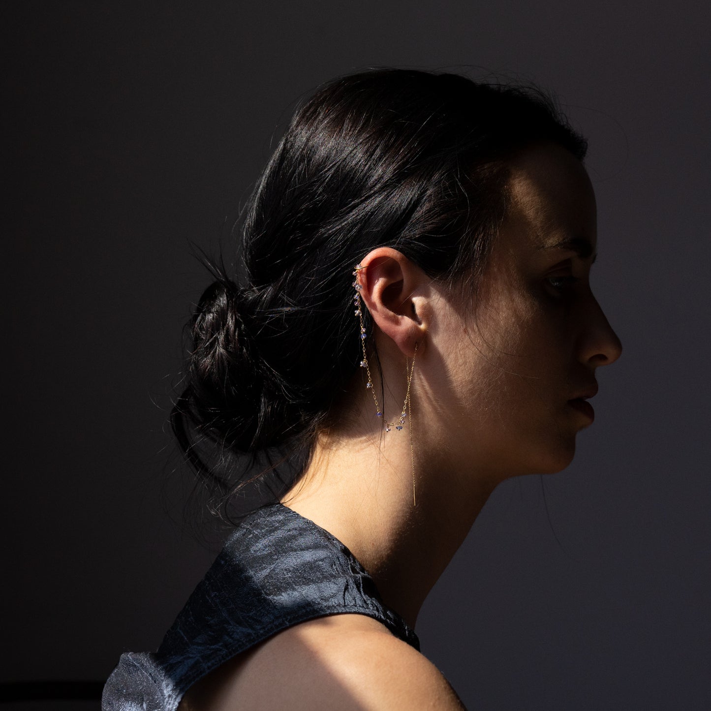 18ct yellow gold thread though earring with chain to ear cuff and tanzanite and amethyst beads on model