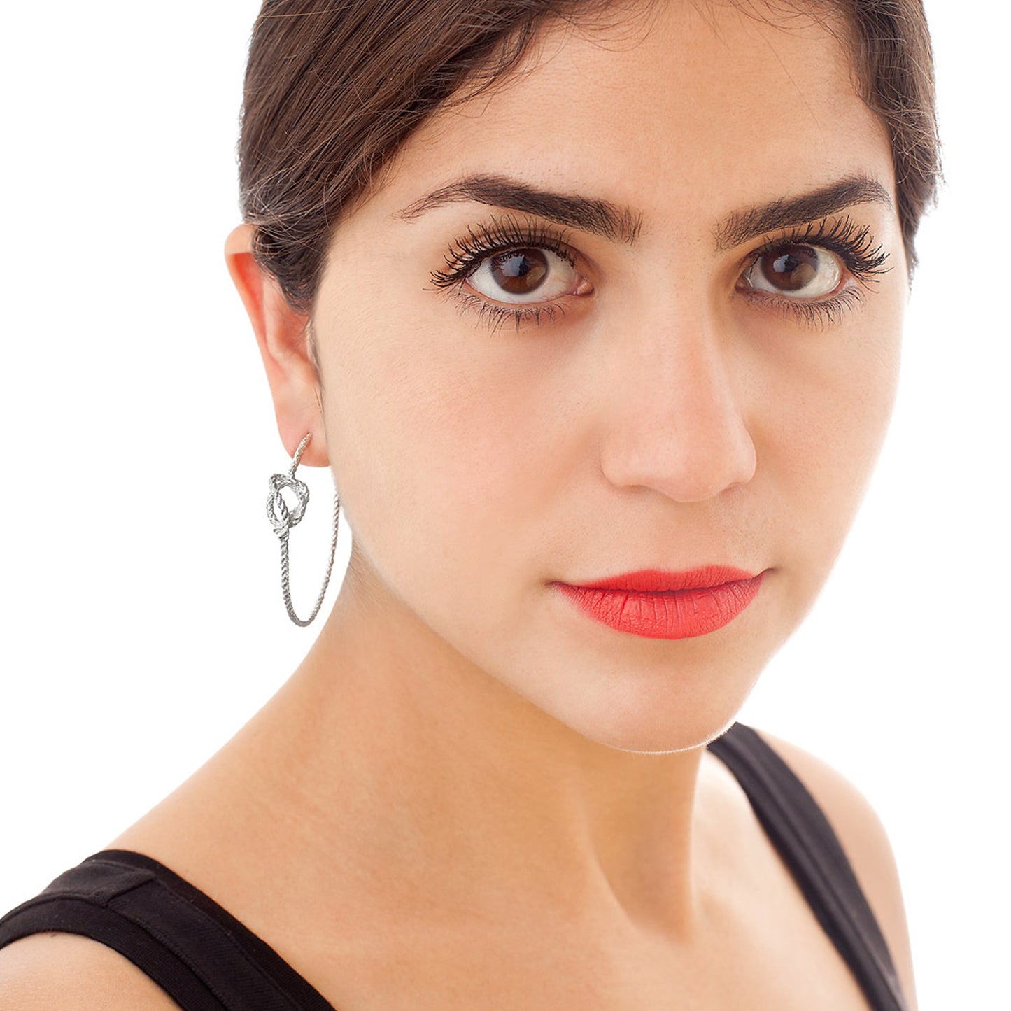 Twisted Knot Hoops shown worn in silver version with approximately 4cm hoop diameter