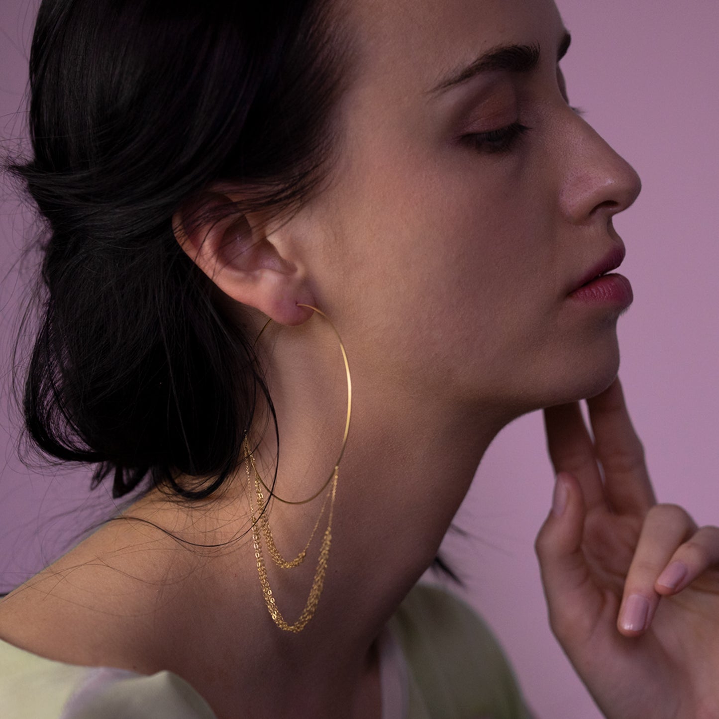 18ct yellow gold hoop with looped layered chains on model