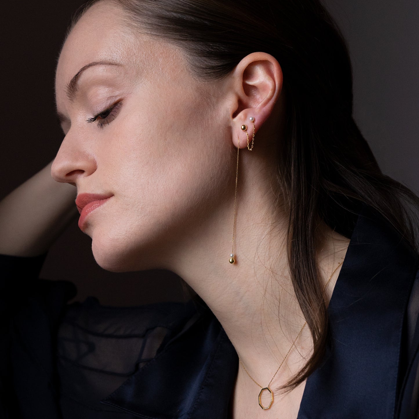Pearl and Golden Ball Thread Through Earrings on model