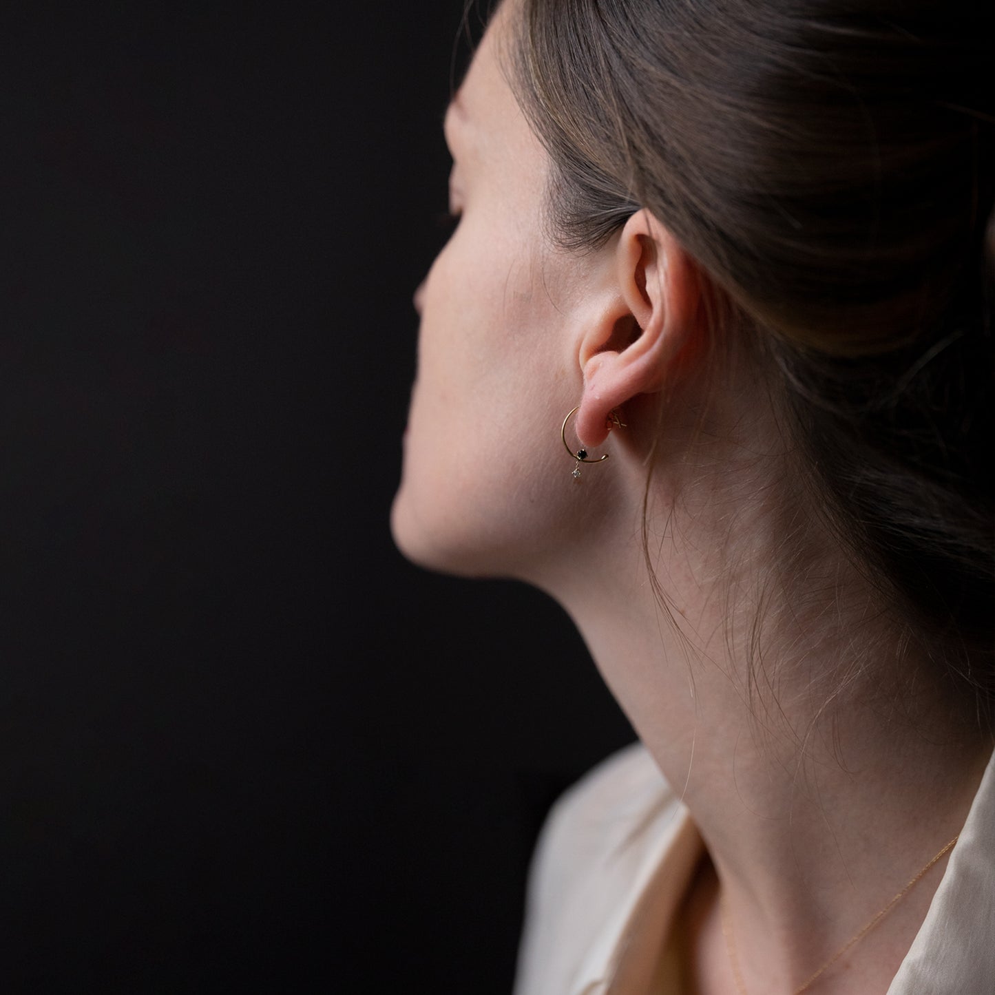 18ct yellow gold hoops with Black and White Diamond on model