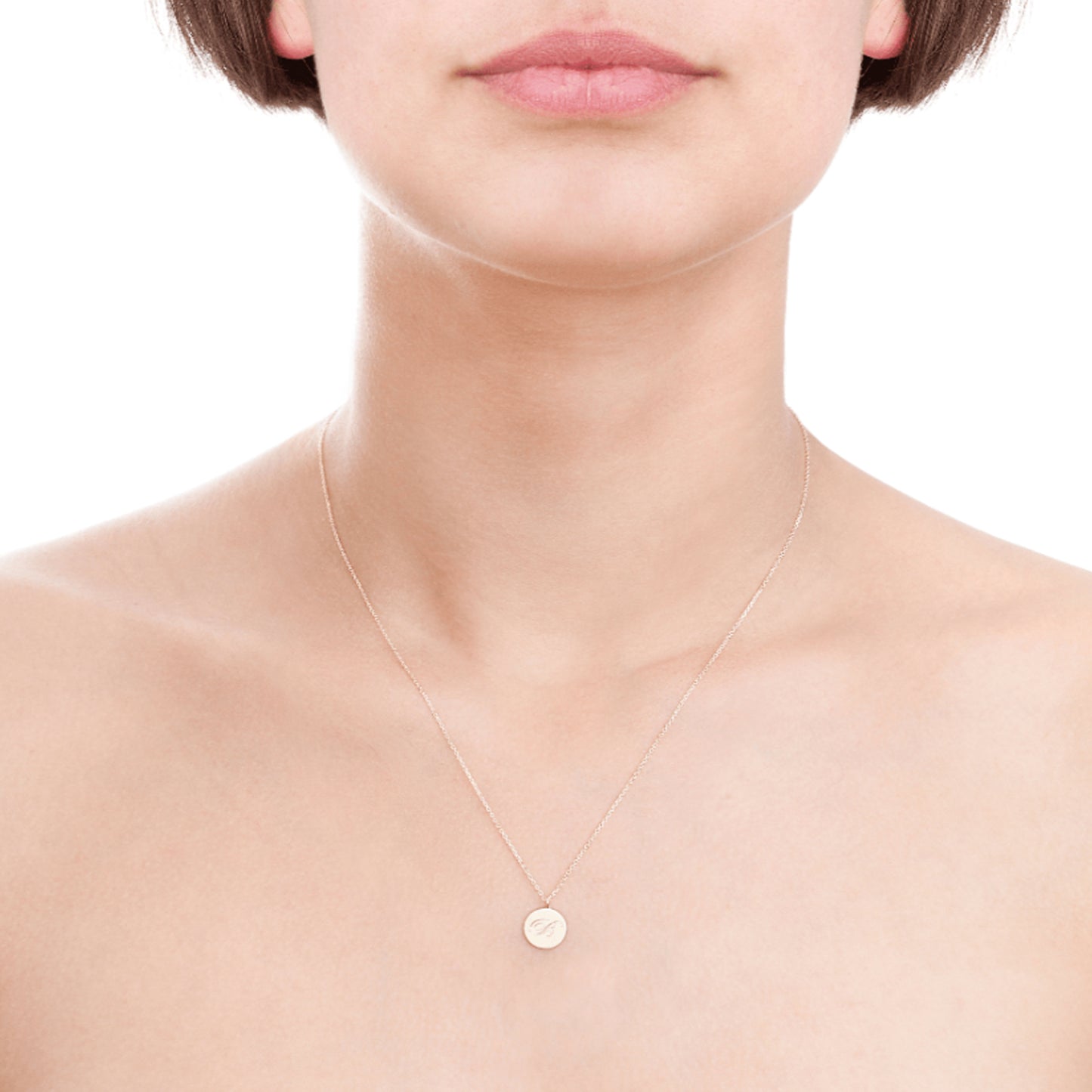 Laura Lee 9ct rose gold disc necklace with engraved script initial seen on a women.