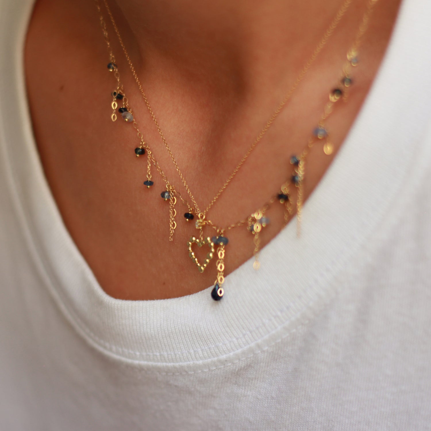 Pogo Punk Blue Sapphire Necklace on model with love letters heart necklace