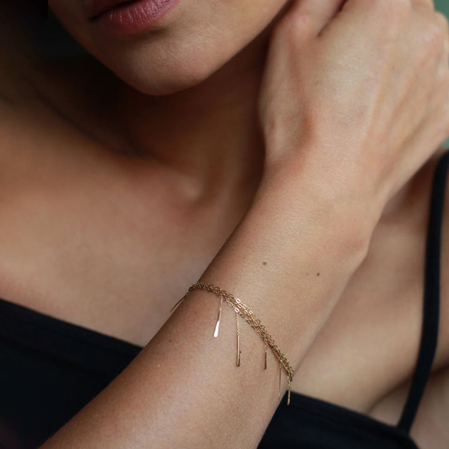 18ct gold layered chain bracelet with hanging bars on model
