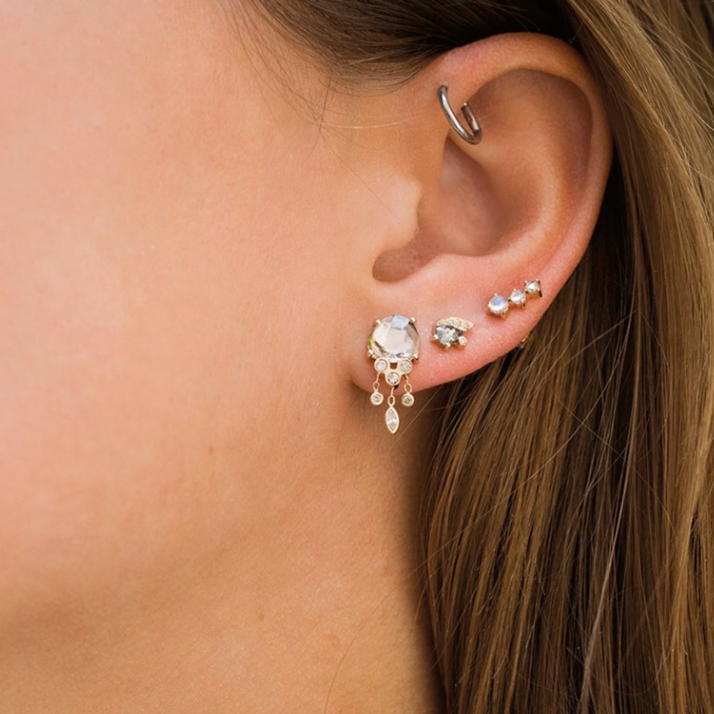 Celine Daoust 14k light yellow gold earrings with two Moonstones and one rose cut Diamond on model