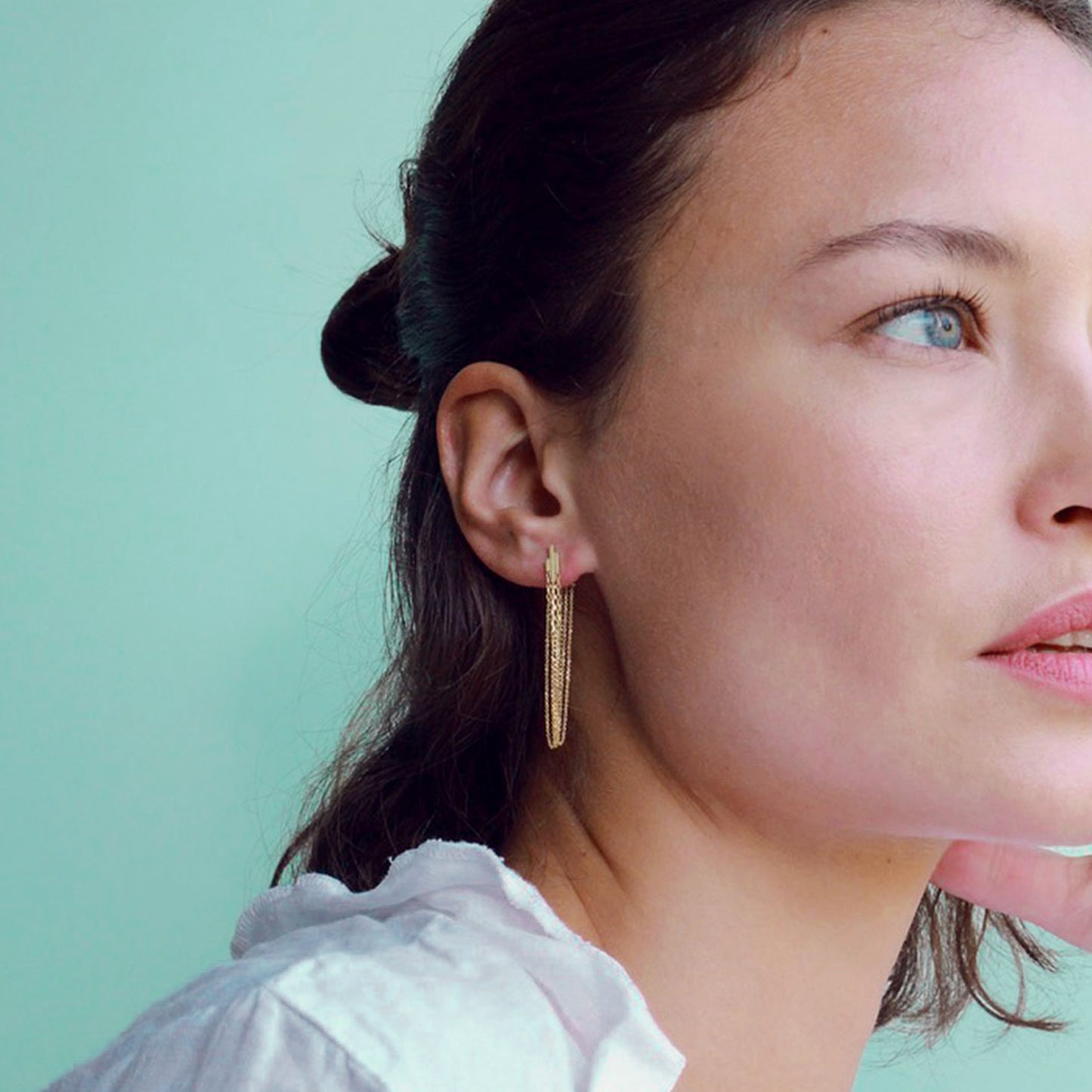 DECO DECADENCE STUDS WITH LAYERED CHAINS ON MODEL