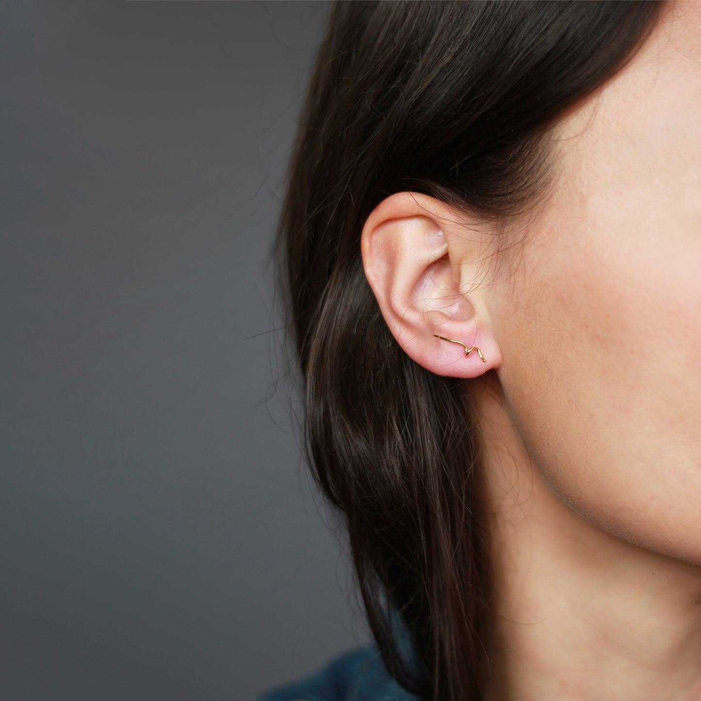 doodles in gold 18ct yellow gold doodle stud on model