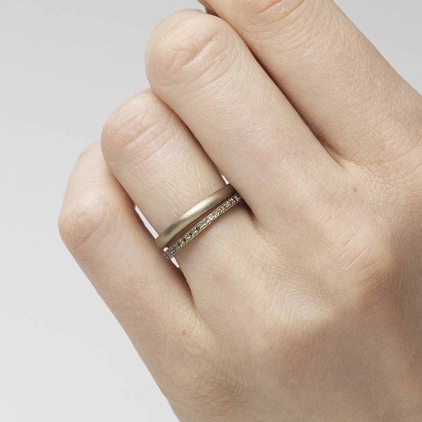 9ct white gold organic, irregular band ring. Stacked with a diamond eternity band.