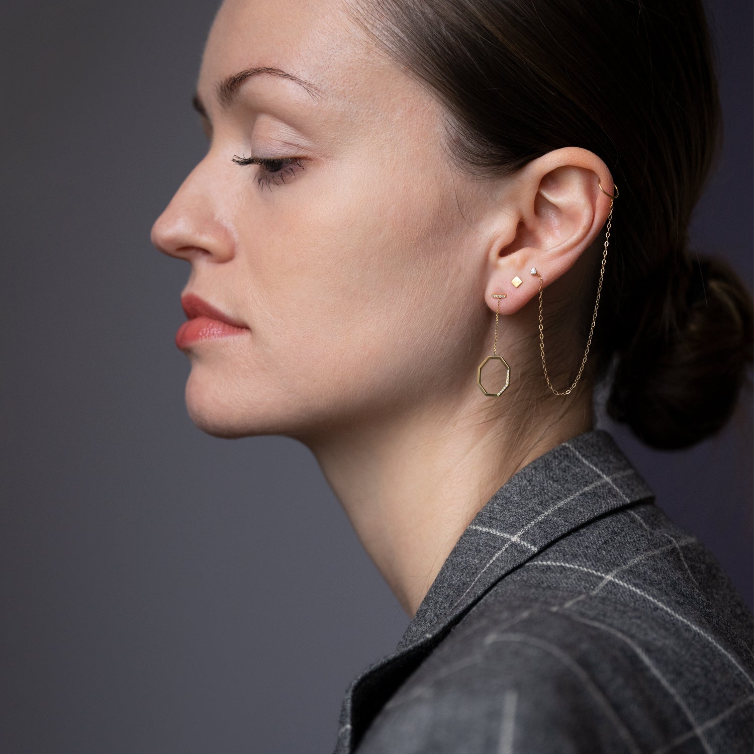 18ct yellow gold octagon drop earrings with Diamond set bar studs and hanging solid gold octagon shape pave set with 15 Diamonds on model