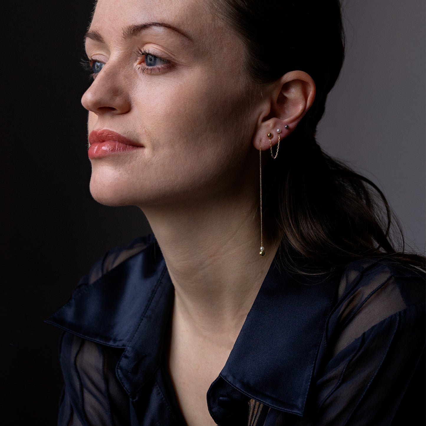 Pearl and Golden Ball Thread Through Earrings on model