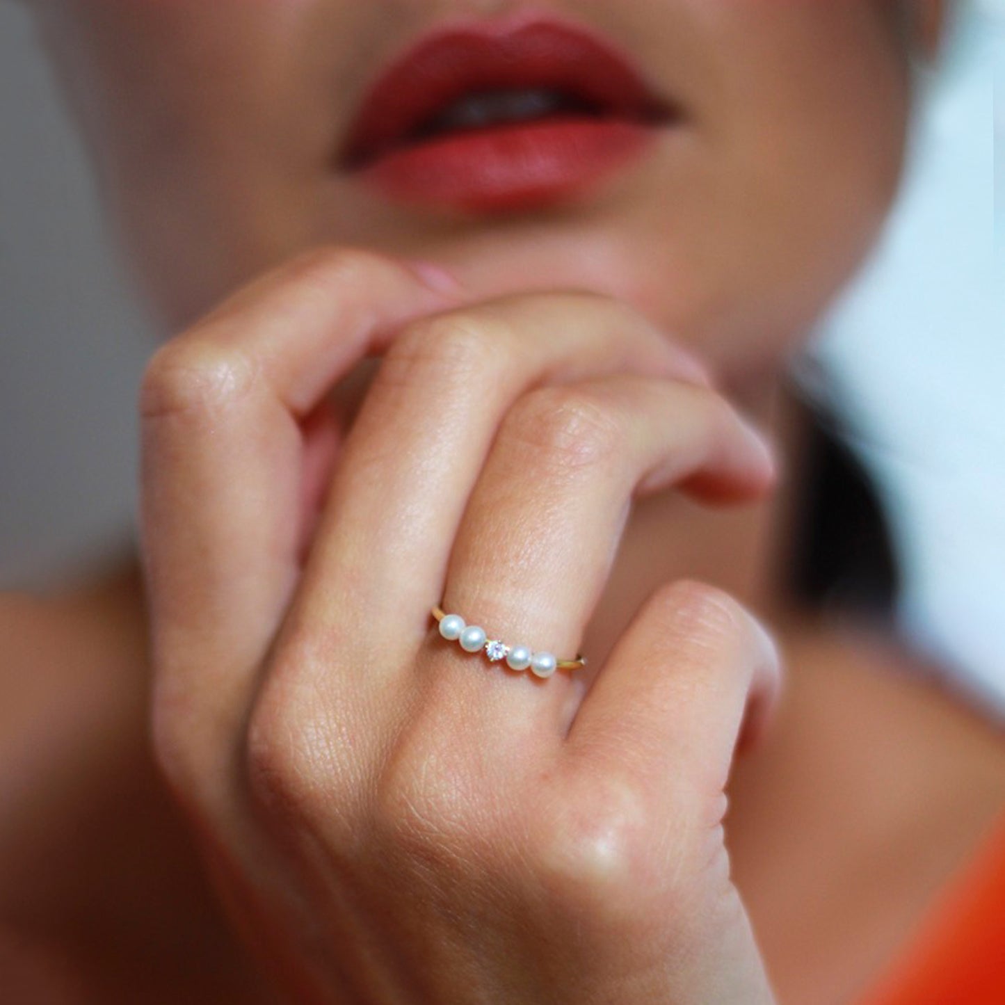 Diamond and Four Pearl Ring 18ct yellow gold ring with 4 pearls and a diamond  on model