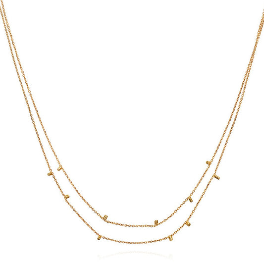 This cute 18 ct yellow double strand necklace is made of fine chain sprinkled with a shimmering of gold embellishments and is part of our Gold Dust Collection.