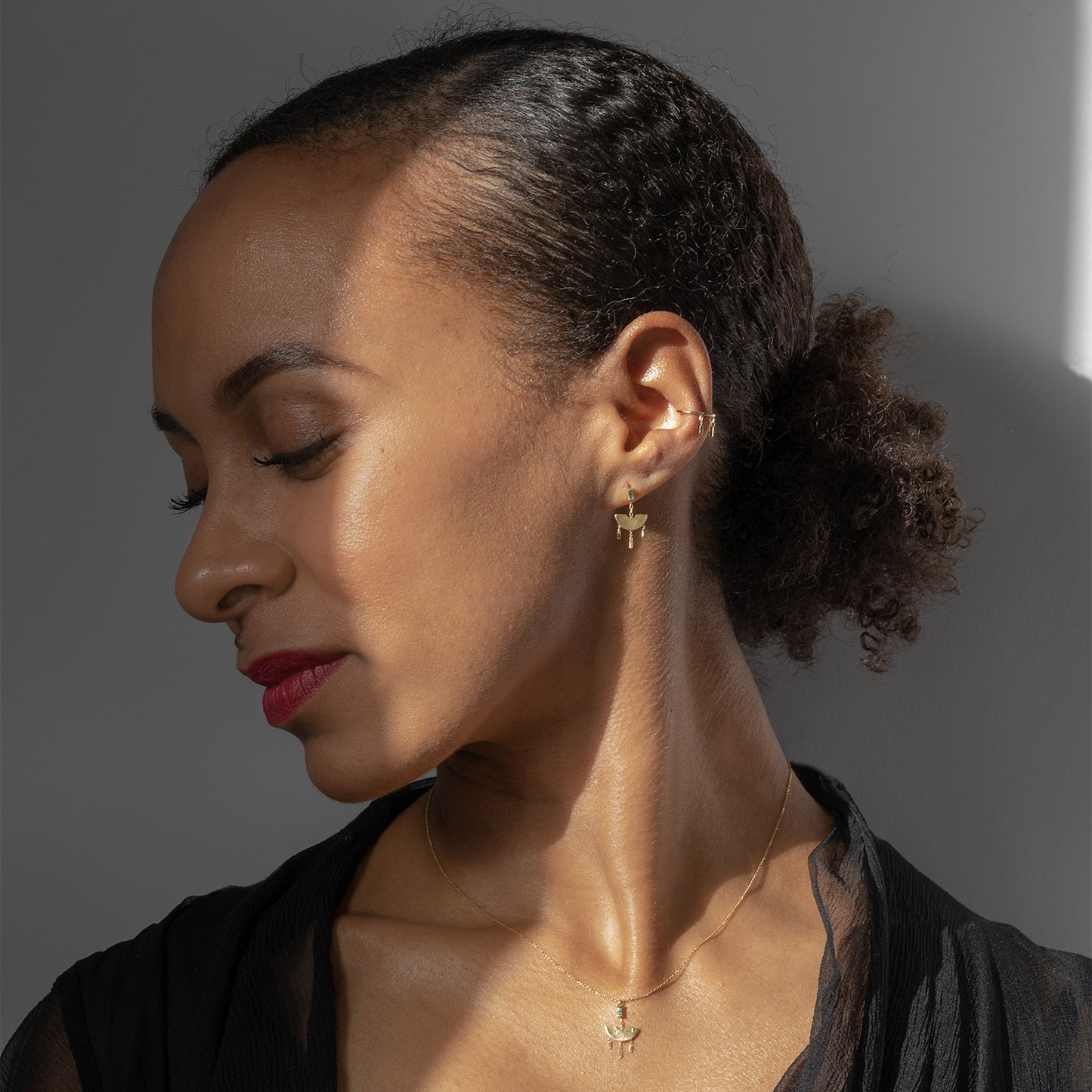 Enchanting Emeralds Dangling Earrings on model