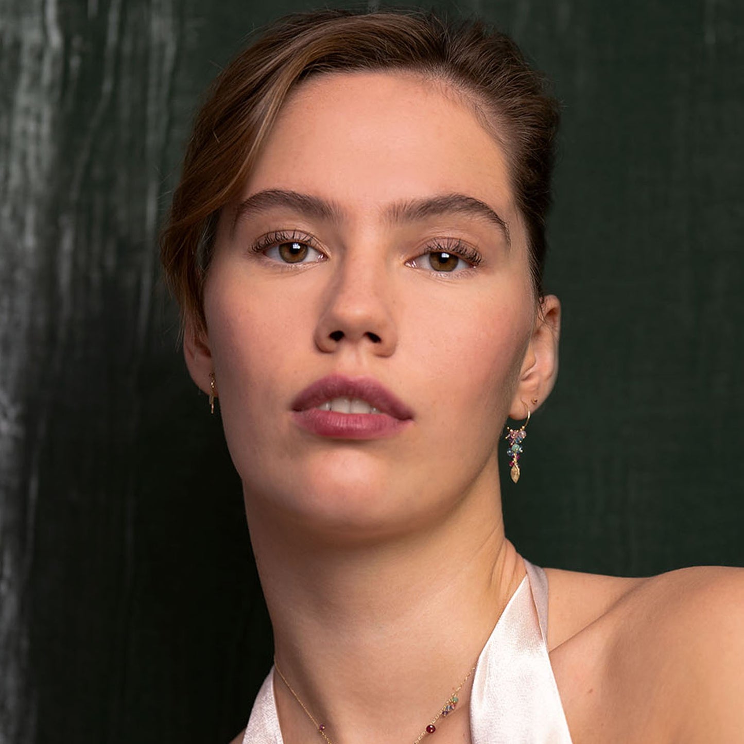 18ct gold baby hoops, featuring a grape cluster of stones and a Gold leaf drop worn by model