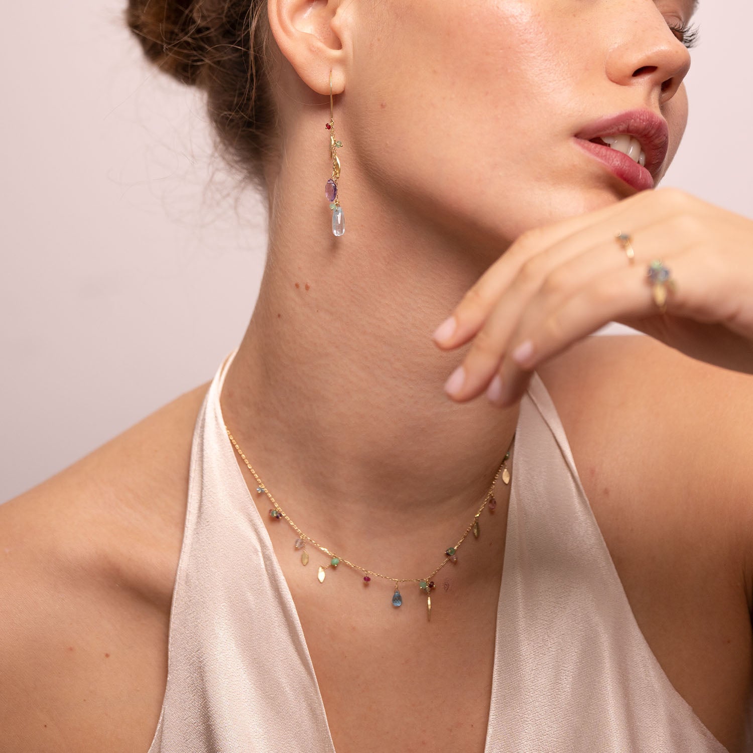 18ct Gold chain necklace with mixed stones, drops and five gold leaves worn by model