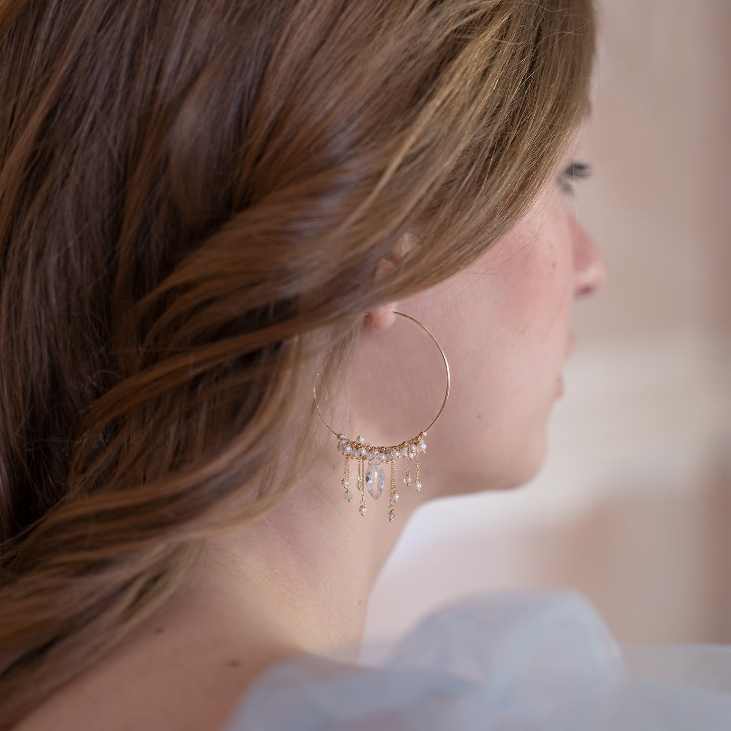 18ct Gold Goddess of Love hoop earrings with clusters of Pearl and Crystal beads/drops on model