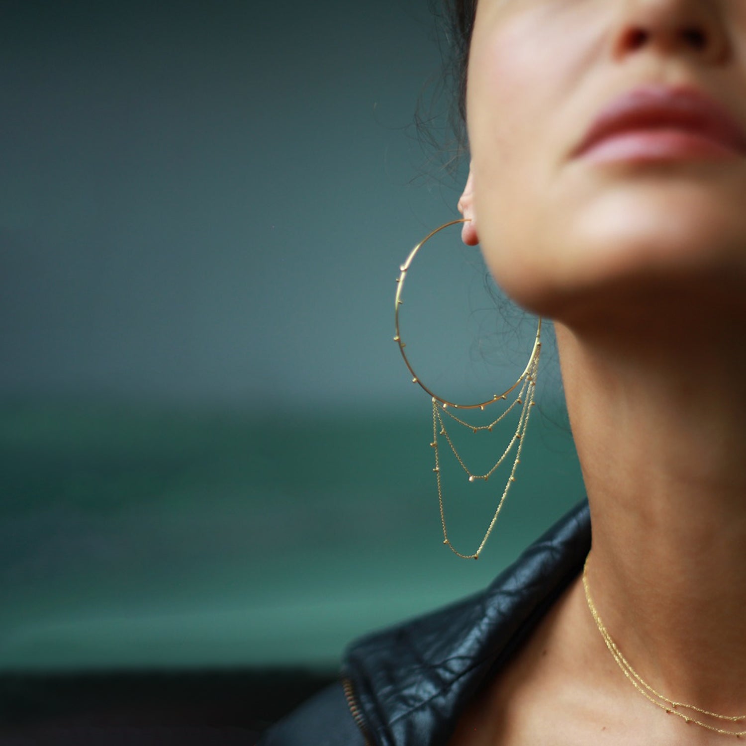These fabulous large 18ct yellow hoop earrings with layers of fine chain sprinkled with a shimmering of gold embellishments are part of Gold Dust Collection. Glamourous and chic they are the perfect addition to any outfit on model