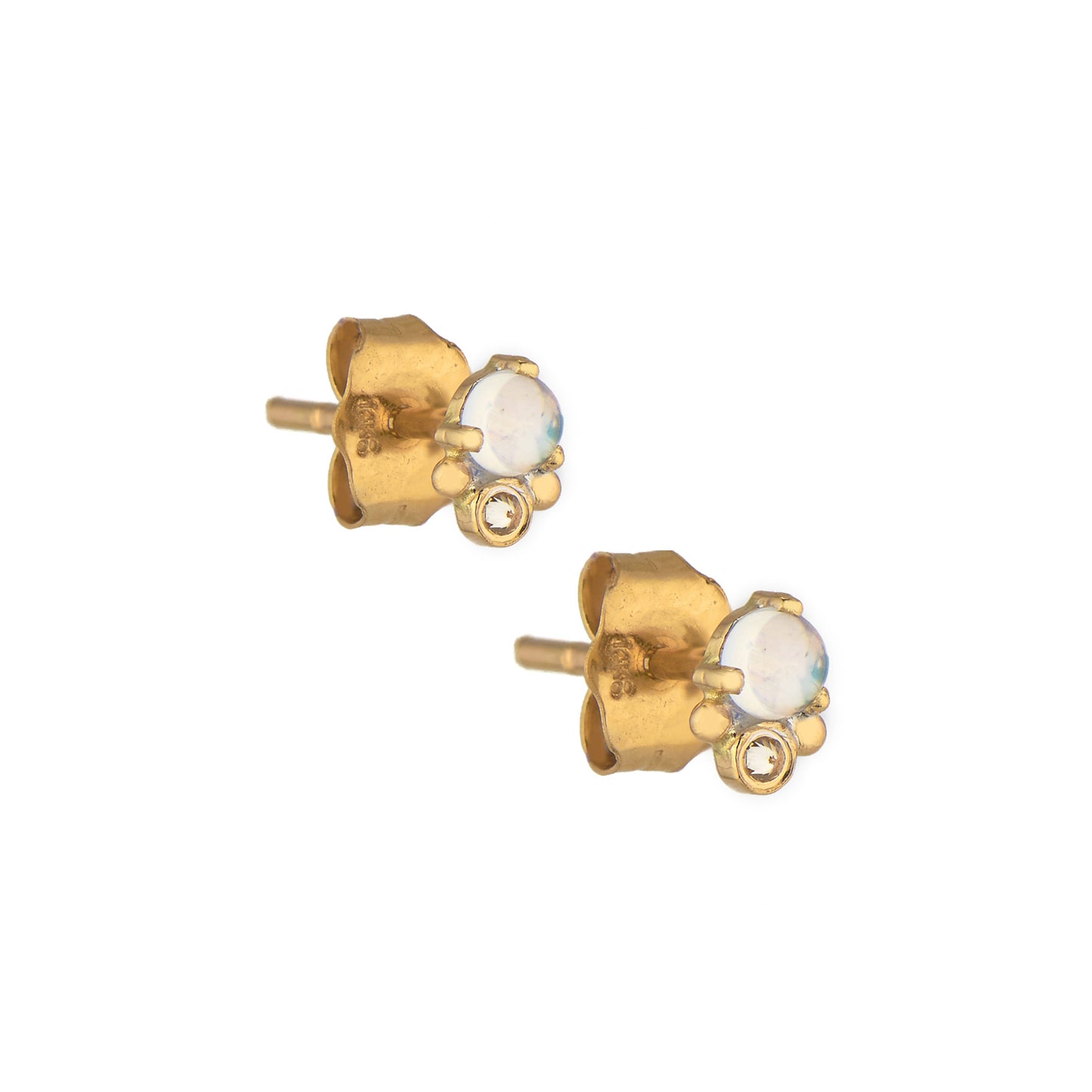 Celine Daoust 14k light yellow gold stud earrings with one round moonstone and one reversed setting diamond.