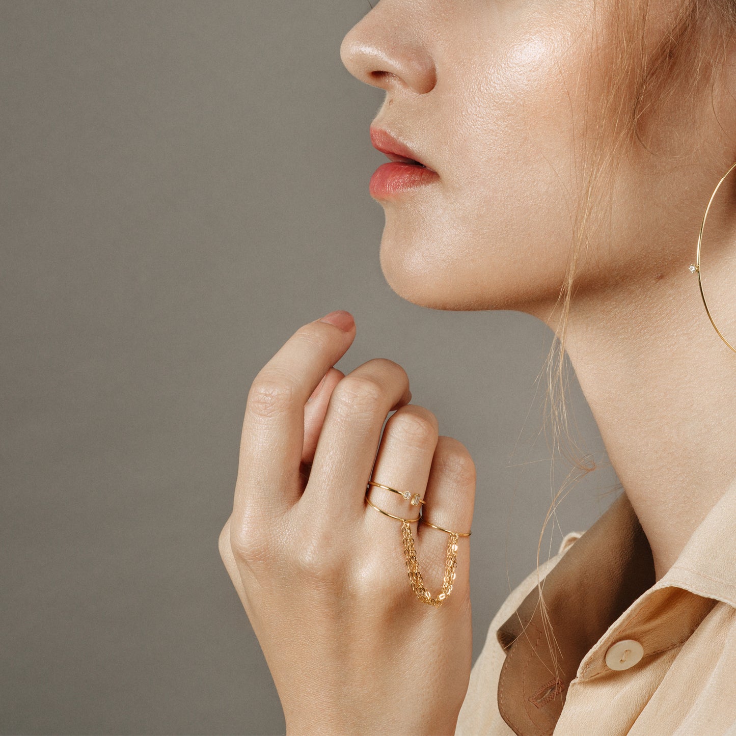 18ct yellow gold double ring with layered connecting chains on model