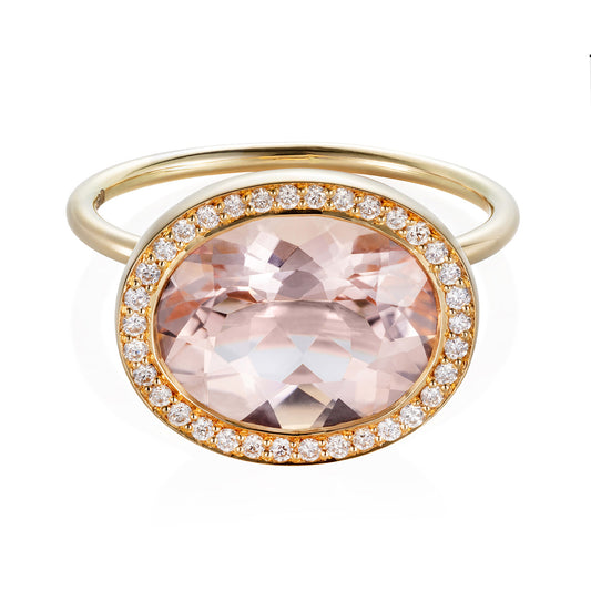 Sweet Pea 18ct yellow gold cocktail engagement ring with large, raised peach oval sapphire with a pave set diamond surround.