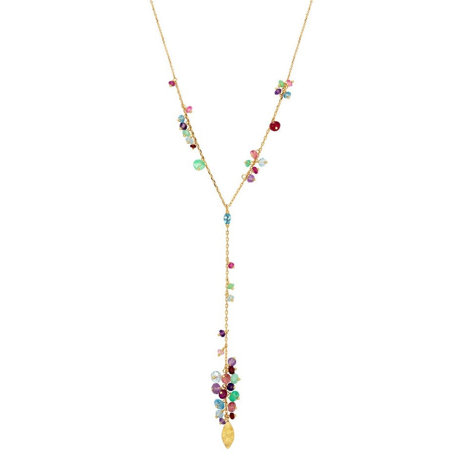 Close up of 18ct Gold Y shaped necklace with claw set Swiss blue Topaz and clusters of mixed stones with a Gold leaf pendant.