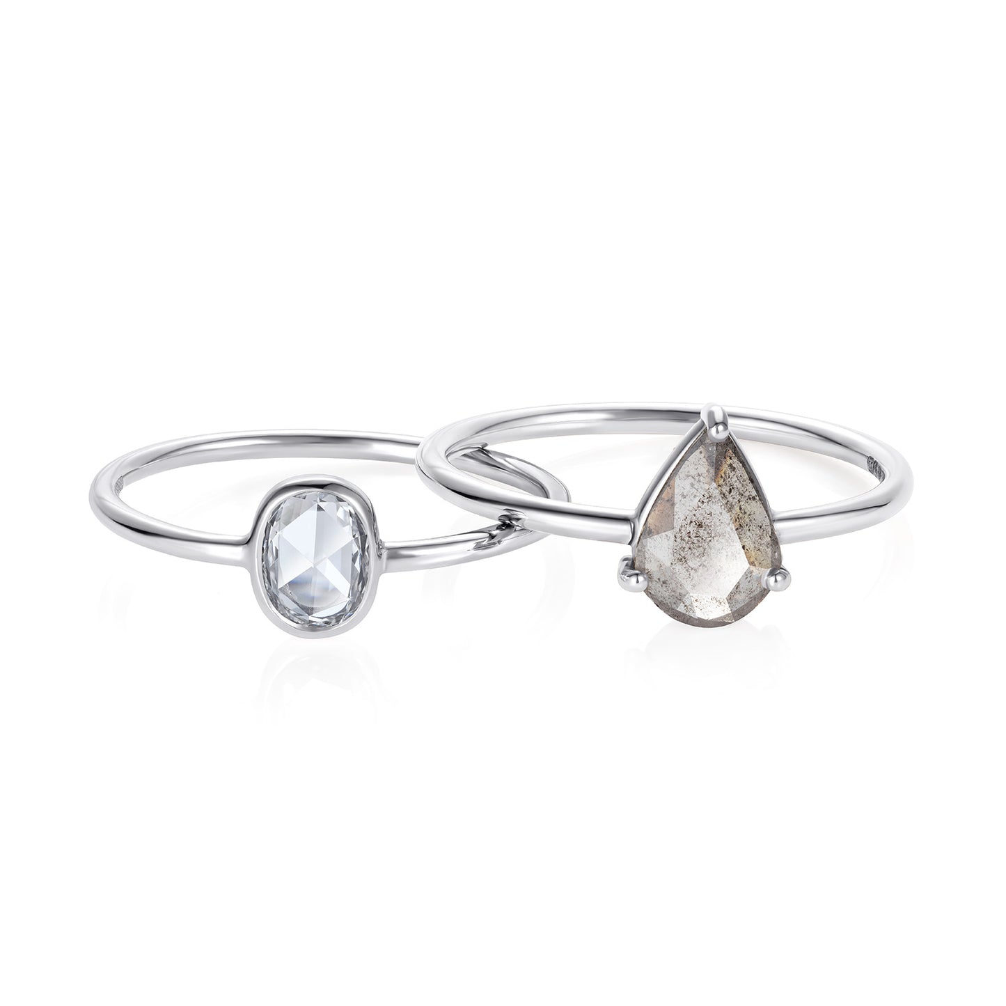 Sweet Pea 18ct white gold grey diamond pear shaped ring seen with an oval rose cut ring. white gold engagement rings.