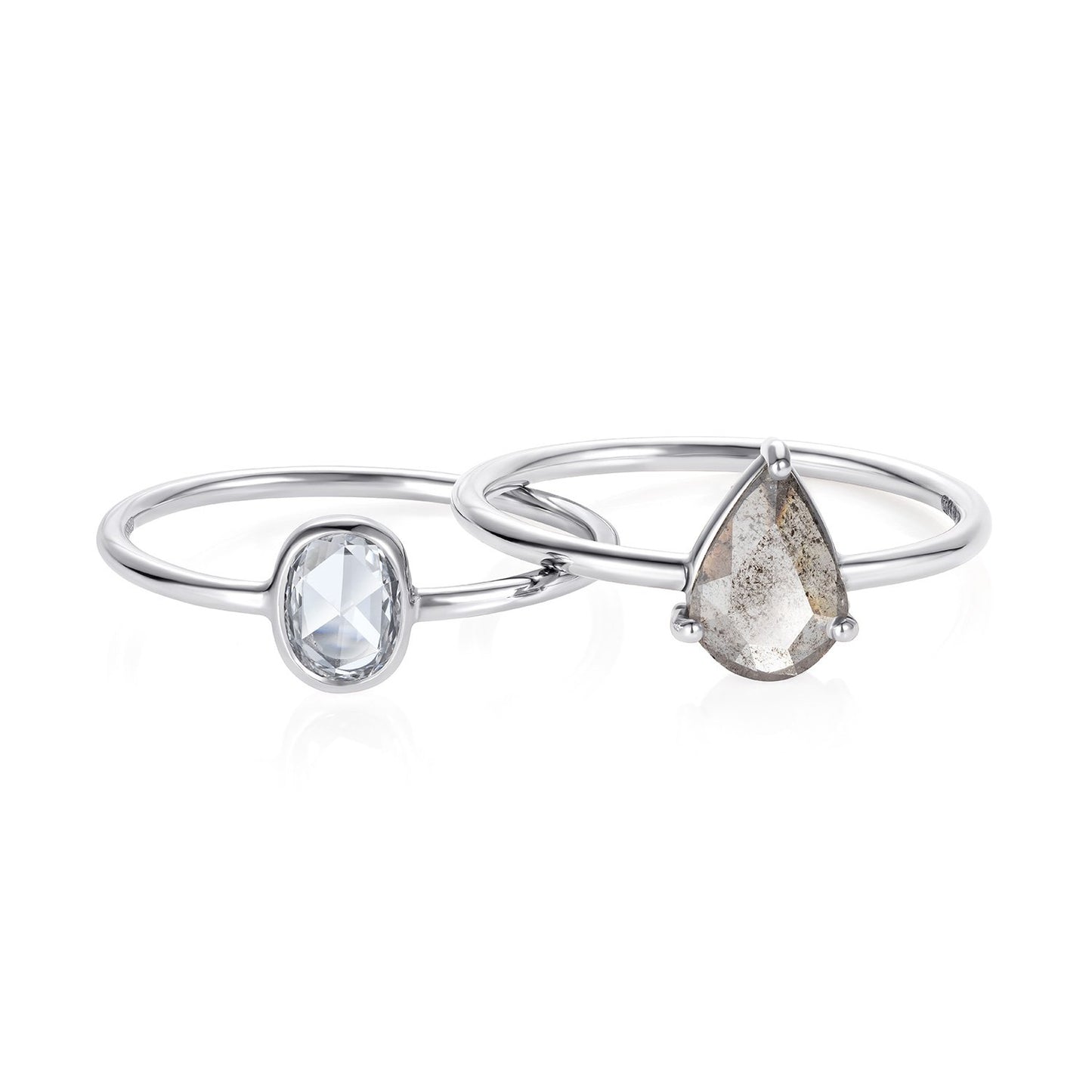 Sweet Pea 18ct white gold oval rose cut diamond ring seen with a grey pear shaped ring. white gold engagement rings.