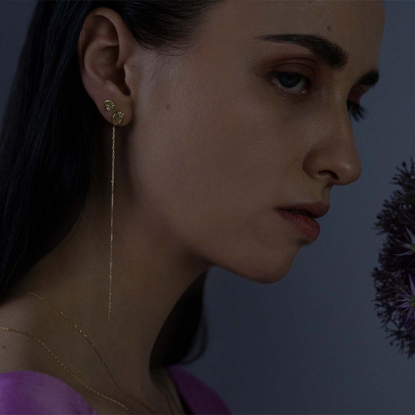 Sweet Pea Moonscape recycled 18ct yellow gold nugget stud earring set with white diamonds and long hanging chains on women ear, layered with nugget and diamond stud earring.