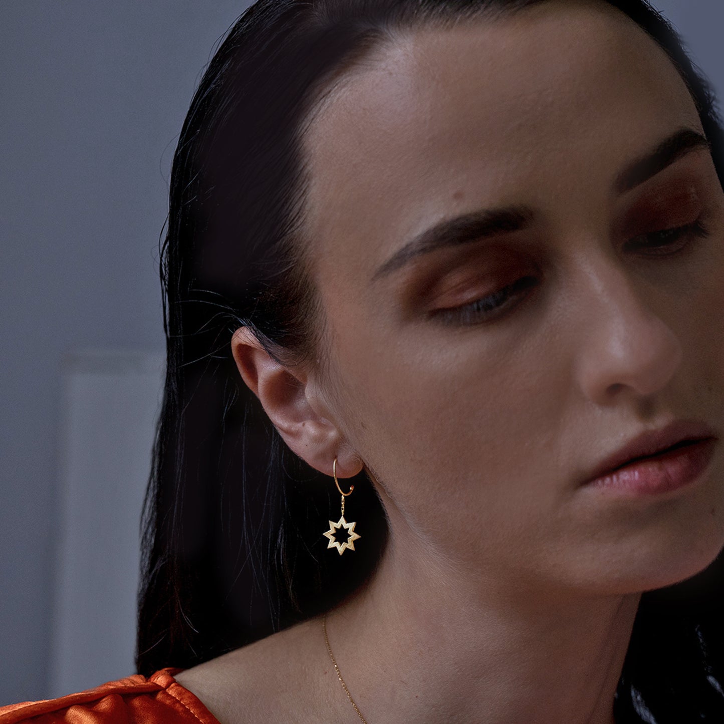 Sweet Pea 18ct yellow gold Reach For The Stars small hoop hanging earring on model. Star and small hoop earring on model.