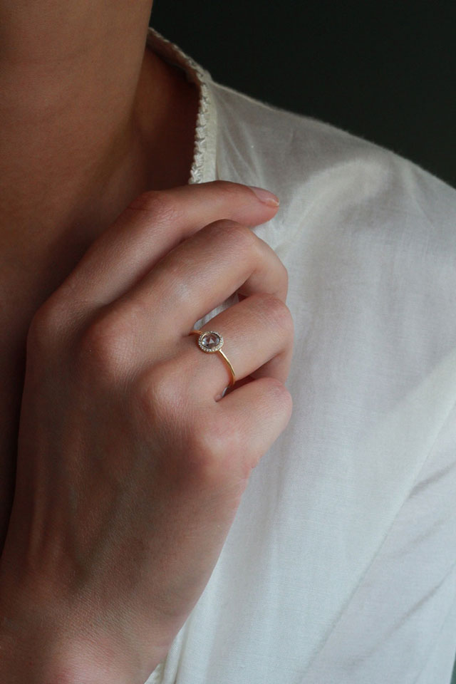 Sweet Pea 18ct yellow gold ring with pink round, rose cute sapphire with a diamonds halo on model. 20% of sale going to Breast Cancer Support in October 2021.