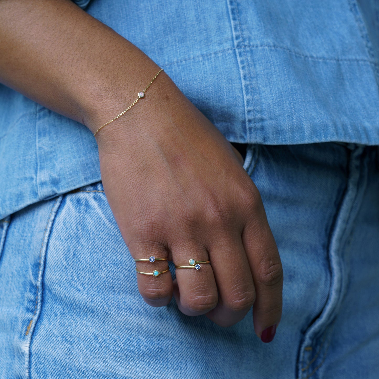 gold and tanzanite ring on model