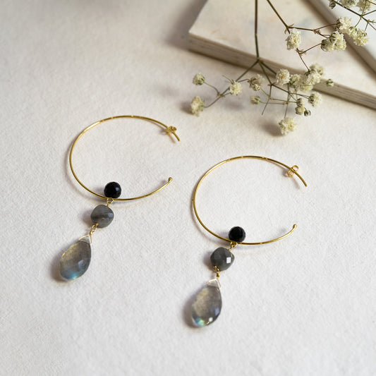 18ct gold hoop earrings with onyx floating ball with grey quartz square bead and large labrodite drops.