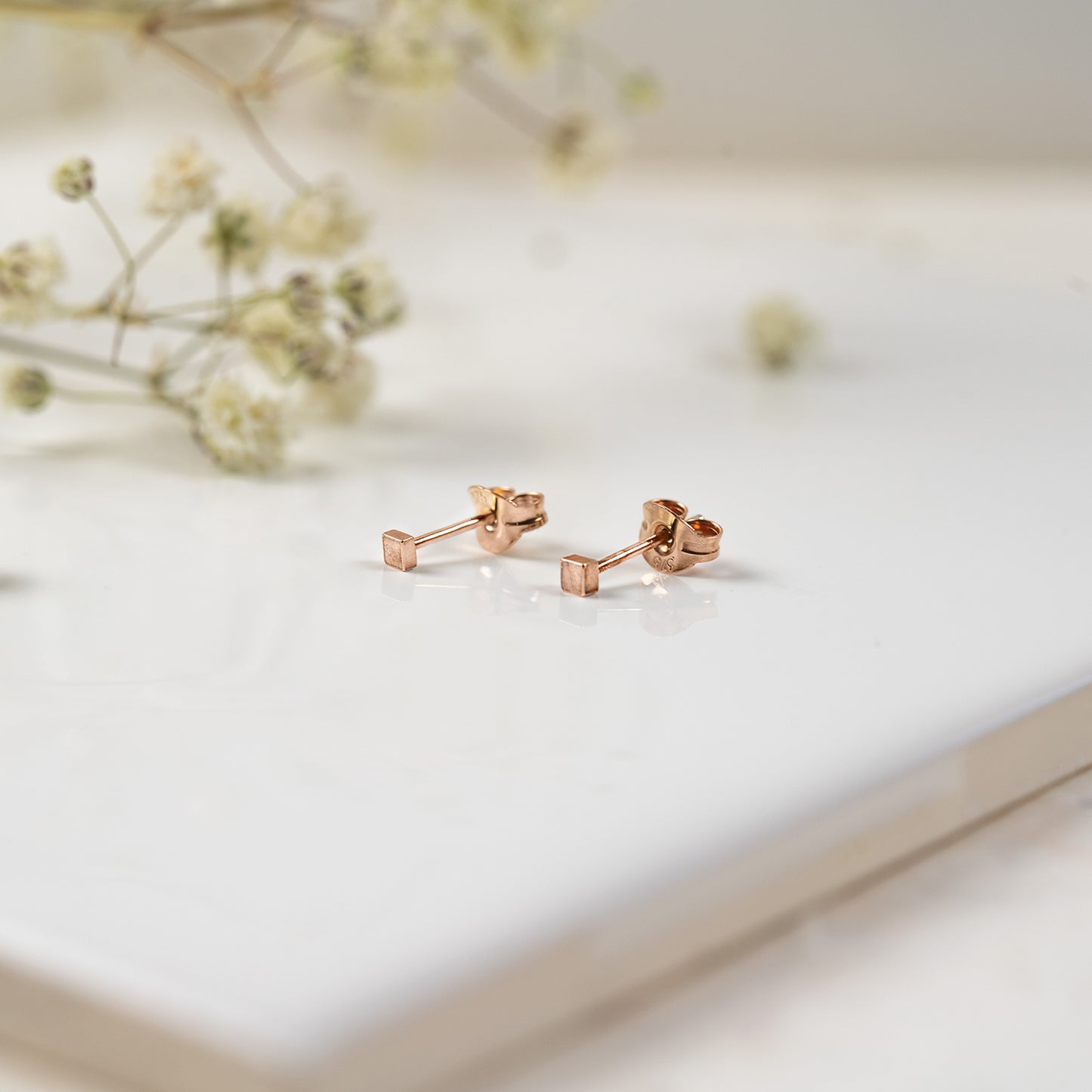 9ct rose gold small square stud earrings.