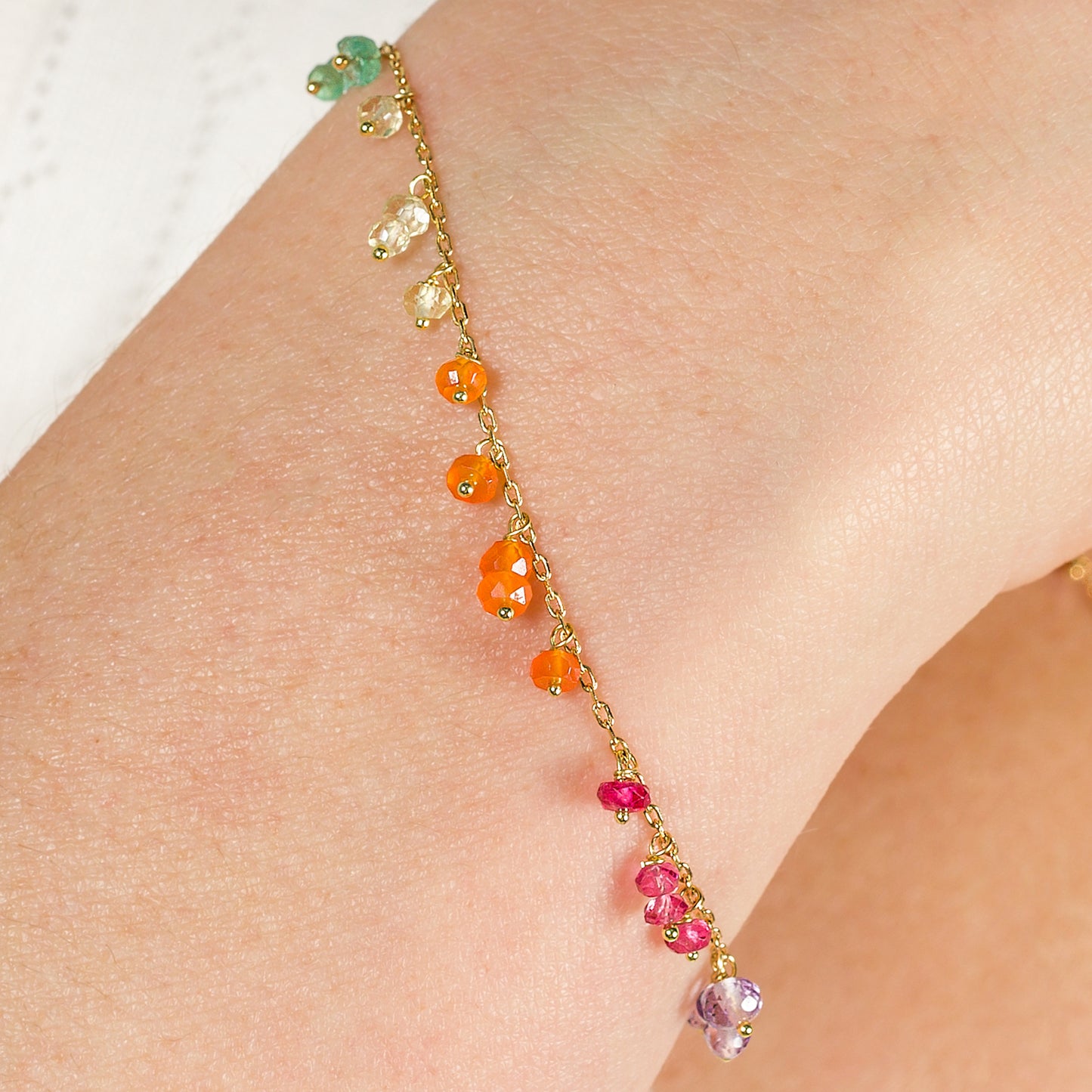 Sweet Pea 18ct gold Love is Love rainbow bracelet on model