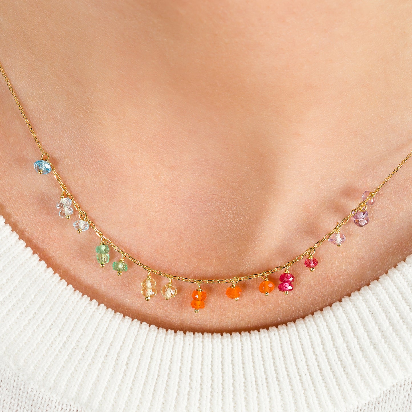 Sweet Pea 18ct gold Love is Love short rainbow necklace on model