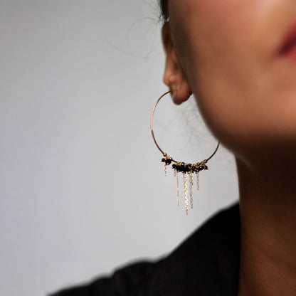 18ct yellow gold hoops with hanging chain and black Spinel beads on model