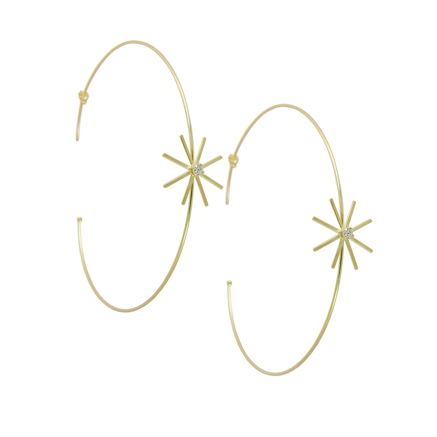 These 18ct yellow gold fine large diamond hoop earrings are from our Pop Up Daisy Collection. The Flower motif is made up from fine gold petals and features a central Diamond set collet.