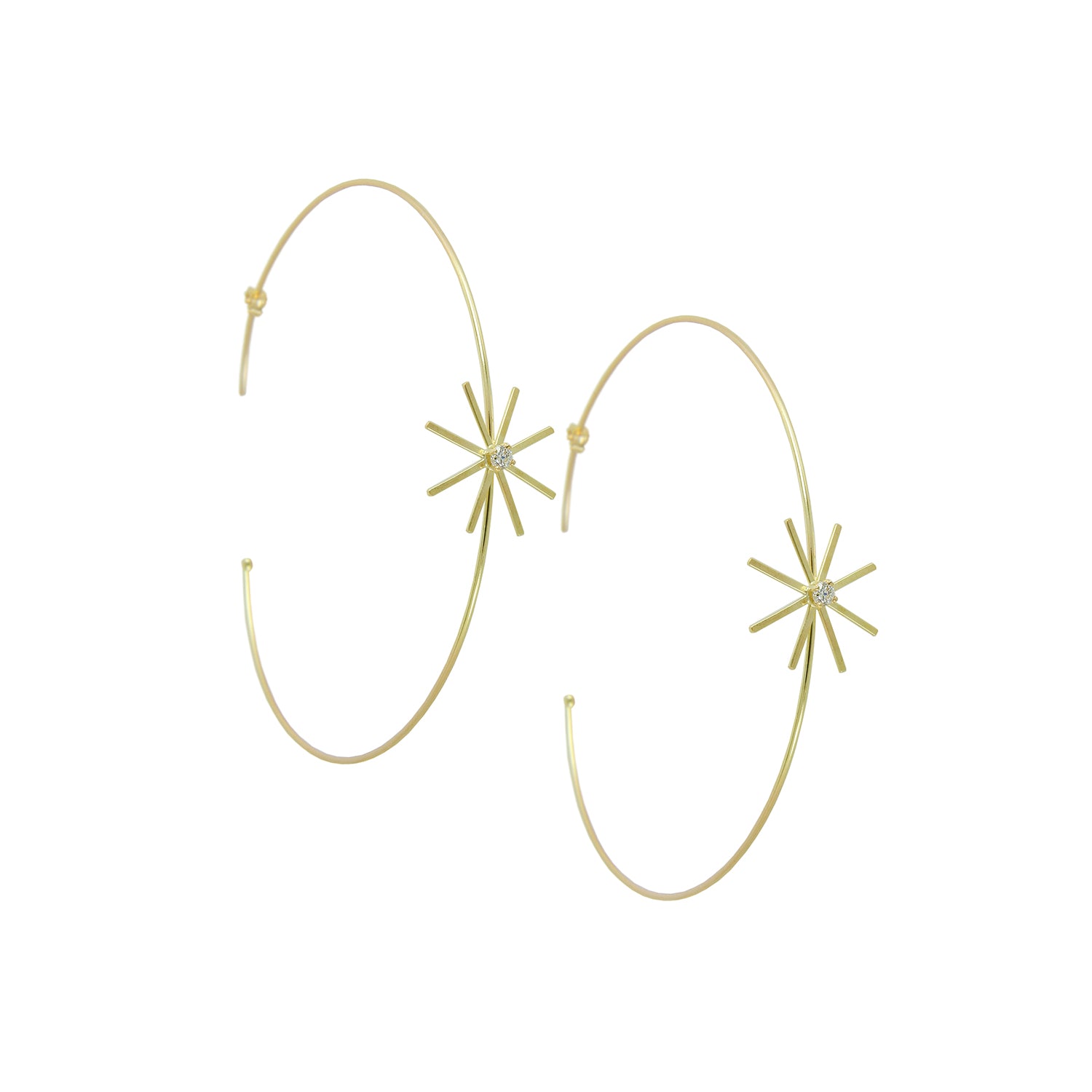 These 18ct yellow gold fine medium diamond hoop earrings are from our Pop Up Daisy Collection. The Flower motif is made up from fine gold petals and features a central Diamond set collet.