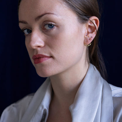 18ct yellow gold Ruby studs on model