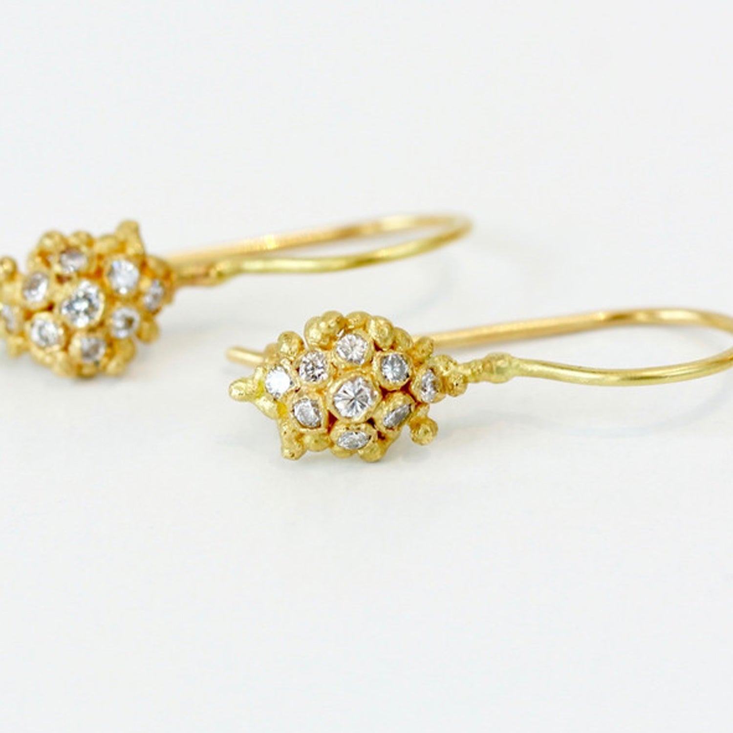 Ruth Tomlinson 18ct yellow gold cluster hook earrings set with diamonds.