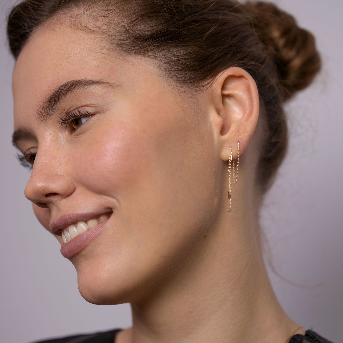 18ct Gold thread through earrings with mixed gold shaped and chains on model
