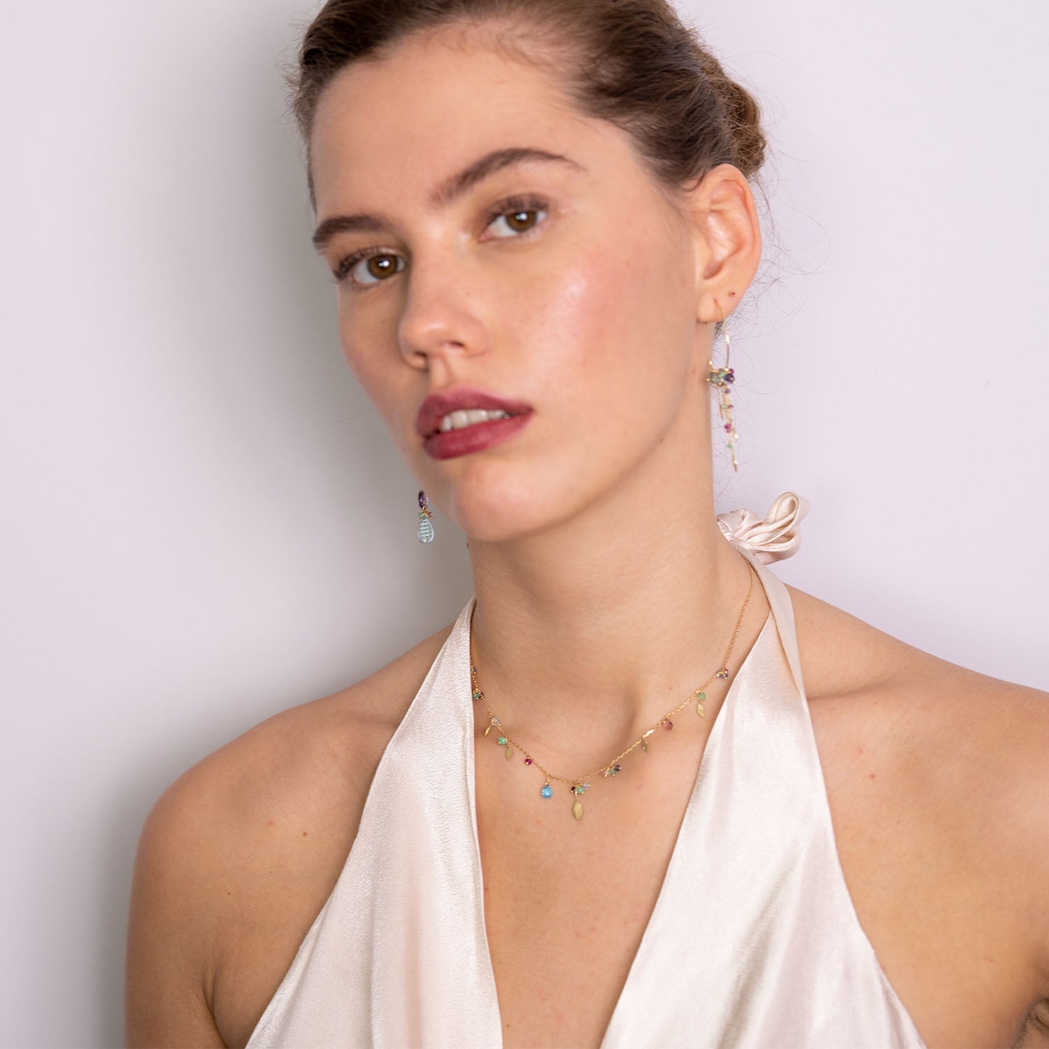18ct Gold chain necklace with mixed stones, drops and five gold leaves worn by model