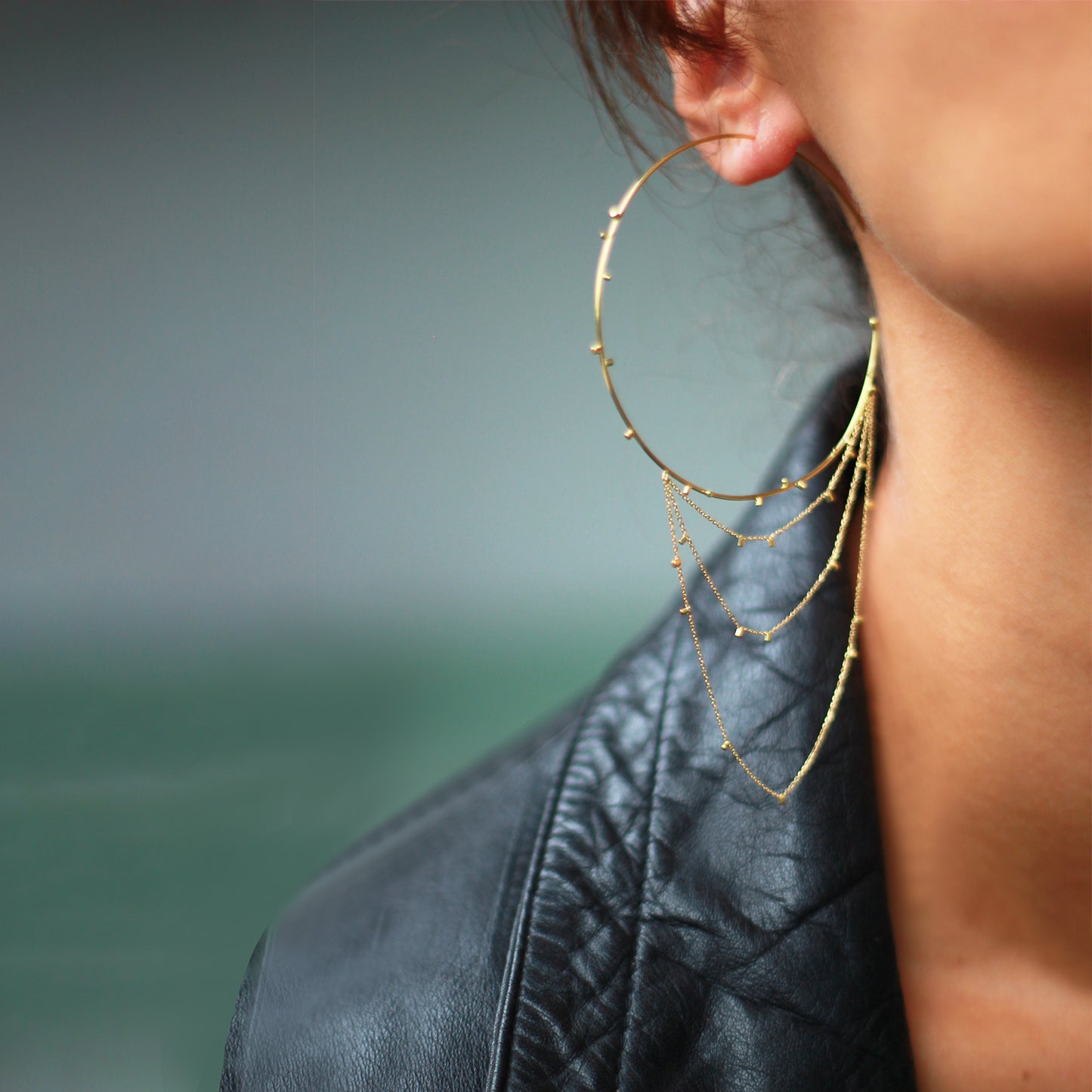 These fabulous large 18ct yellow hoop earrings with layers of fine chain sprinkled with a shimmering of gold embellishments are part of Gold Dust Collection. Glamourous and chic they are the perfect addition to any outfit on model