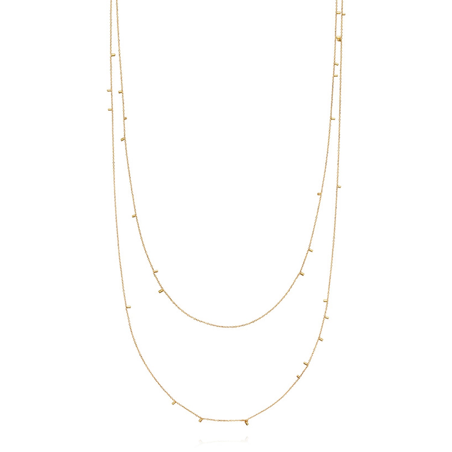 This fabulous long 18ct yellow necklace made of fine chain sprinkled with a shimmering of gold embellishments is part of our Gold Dust Collection