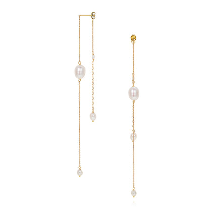 18ct yellow gold double chain earring using a mix of fine chains and white oval shaped fresh water pearls is from our Snowdrop Pearl collection. These earrings hang front and back of the ear creating a delicate layered look.